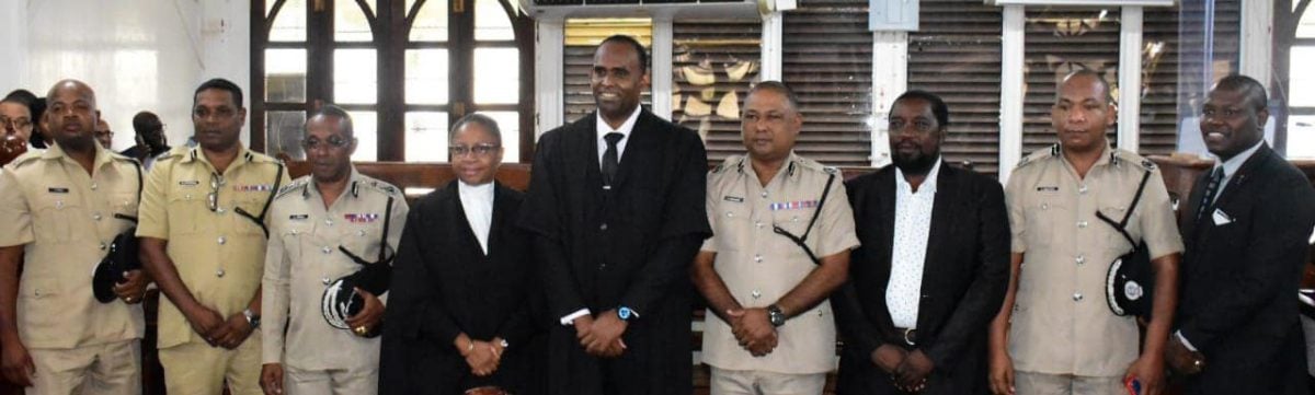 Crime Chief Wendell Blanhum (centre) shared a light moment with acting Commissioner of Police, Clifton Hicken (third from left) and other senior members of the force. (GPF photo)