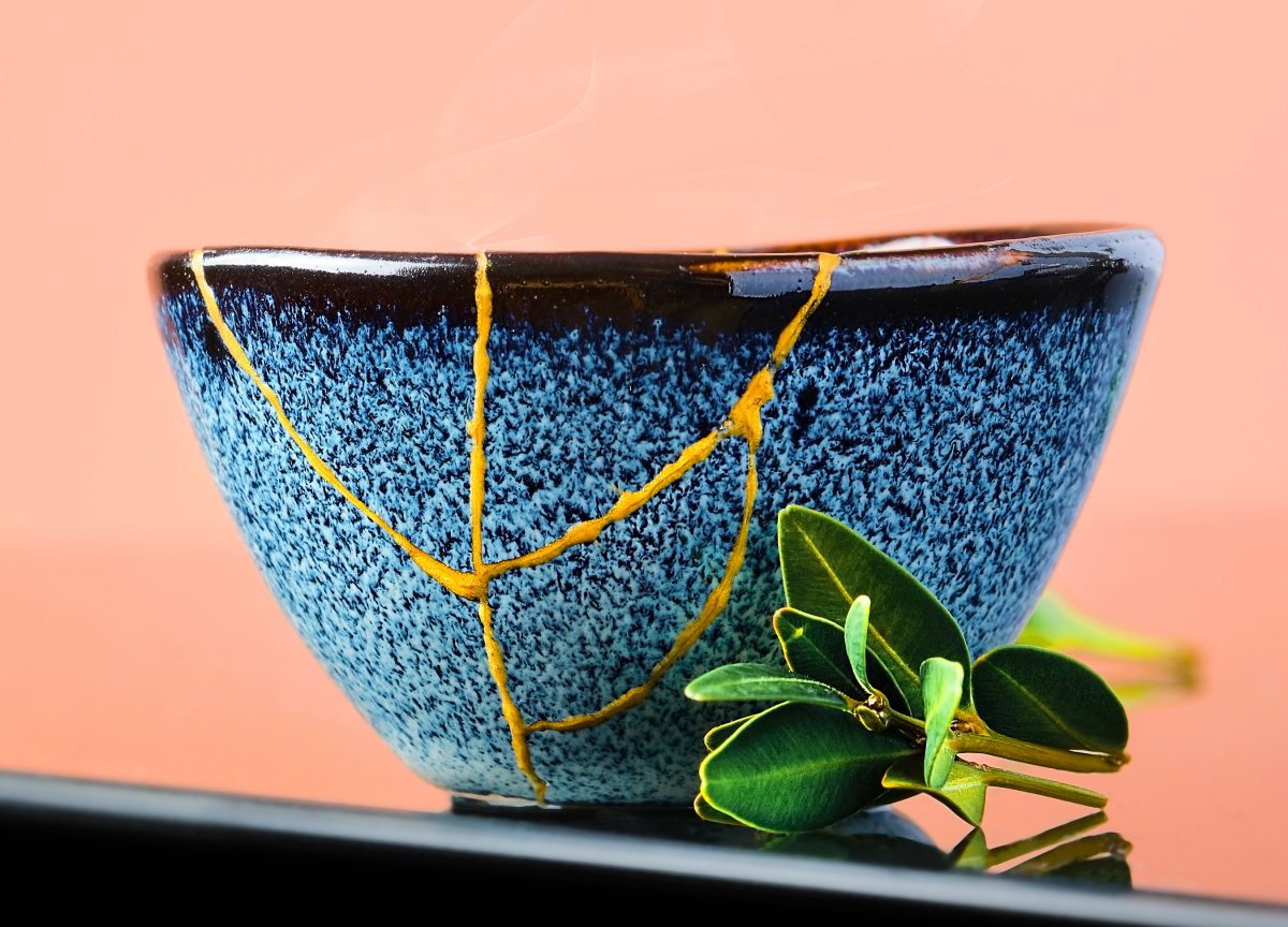A bowl restored with gold along the cracks, using the traditional ‘kintsugi’ restoration technique