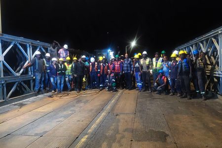 Minister of Public Works, Juan Edghill (centre) posed with the technical team which conducted the emergency works on the Demerara Harbour Bridge over the past few days.
