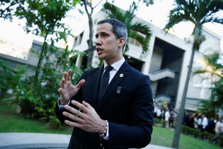 Venezuelan opposition leader Juan Guaido speaks during an interview with local media after the funeral of Father Francisco Jose Virtuoso, rector of the Andres Bello Catholic University, in Caracas, Venezuela October 21, 2022. (REUTERS/Leonardo Fernandez Viloria photo)