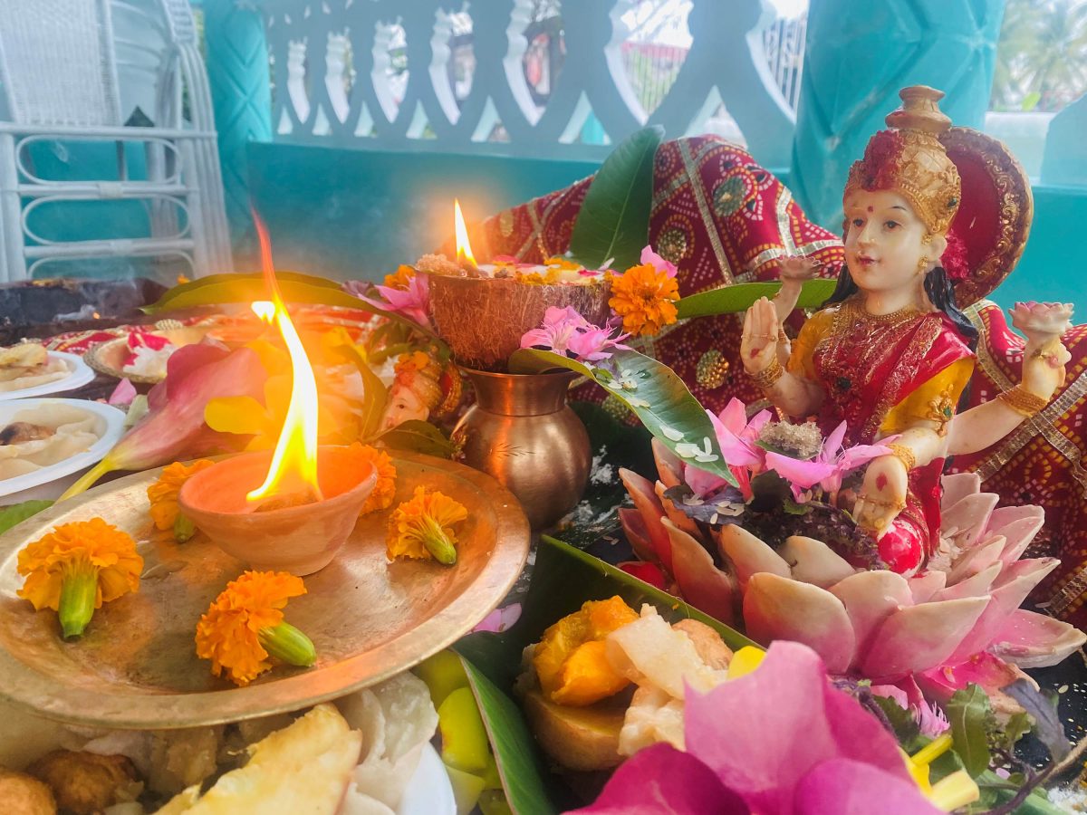 Lakshmi Puja performed by a family before they started to light up the diyas
