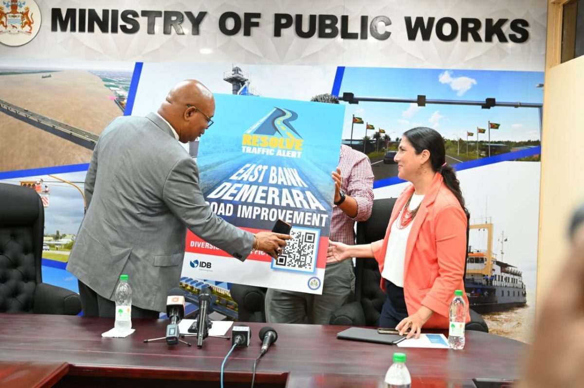 Minister of Public Works, Juan Edghill (left) and IDB country representative, Lorena Solorzano-Salazar on Tuesday launched the RESOLV app. (Ministry of Public Works photo)
