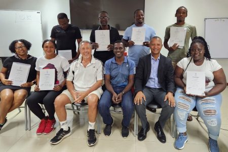 Standing from left, Sham Johnny, Junior Cornette, Andrew Jarvis and Kareem Aaron. Sitting from left Nadine Trotz,  Keisa Burnette Oscar Gadea(instructor,) Raymond Gilson(instructor) Aubrey Hutson (AAG President) Kenisha Headley