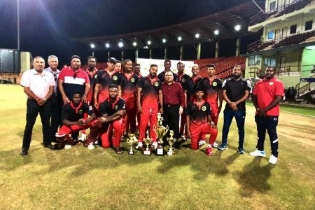 The  Berbice team poses with executives of the Guyana Cricket Board after retaining their 50-over Inter-County title yesterday at the Providence National Stadium.
