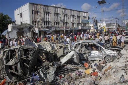 People gather at the scene, a day after a double car bomb attack at a busy junction in Mogadishu, Somalia, on October 30, 2022. AP/PTI
