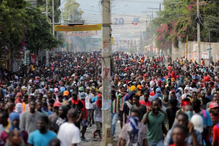 People march during a protest against the government and rising fuel prices, in Port-au-Prince, Haiti October 3, 2022. REUTERS/Ralph Tedy Erol