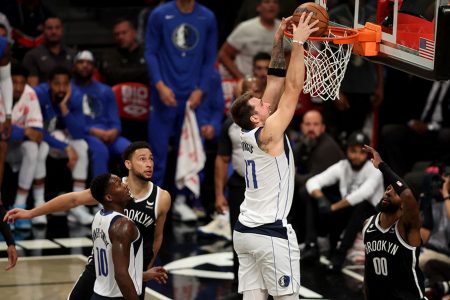  Brooklyn, New York, USA; Dallas Mavericks guard Luka Doncic (77) dunks against Brooklyn Nets guard Ben Simmons (10) and forward Royce O’Neale (00) during the second quarter at Barclays Center. Mandatory Credit: Brad Penner-USA TODAY Sports