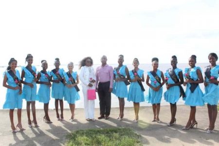  Woman Assistant Superintendent Jillian Moore (sixth, left) and Deputy Commissioner of Administration Calvin Brutus (seventh, left) pose with the 11 contestants
