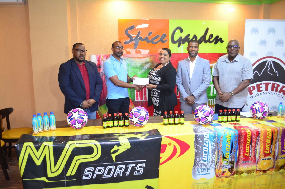 Petra Organization representative Nareeza Latif receiving the sponsorship cheque from MVP Sports chief Eon Ramdeo in the presence of Petra Organization Co-Director Troy Mendonca (left), Director of Sports Steve Ninvalle (2nd from right) and Errol Nelson, Ansa McAl Trading representative.