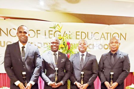 The four senior police ranks who graduated from the Hugh Wooding Law School with their LEC on Saturday. From left are Crime Chief Wendell Blanhum, Assistant Superintendent Delon Fraser, Assistant Superintendent Domnick Bess and Deputy Commissioner ‘Administration’ Calvin Brutus. (GPF photo)