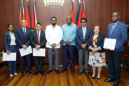 From left are Diana Rajcumar, Rajnarine Singh, Joel Bhagwandin, President Irfaan Ali, Prime Minister Mark Phillips, Attorney General Anil Nandlall, Minister of Governance Gail Teixeira and Berkley Wickham after the July 1st swearing in at the Office of the President.