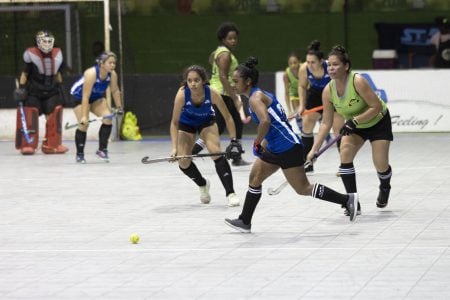 Sandy Roopnarine (blue) of GCC Tigers on the attack during an attacking phase against Woodpecker Hikers  