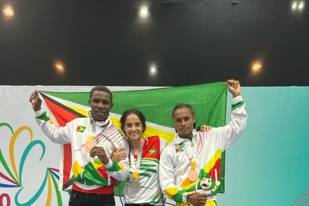 Guyana’s three medalists at this year’s South American Games, Desmond Amsterdam, Nicolette Fernandes and Keevin Allicock. (Keavon Bess photo) 