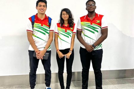 The badminton contingent is Naeem Haque (Coach), Priyanna Ramdhani, Narayan Ramdhani and Akili Haynes.