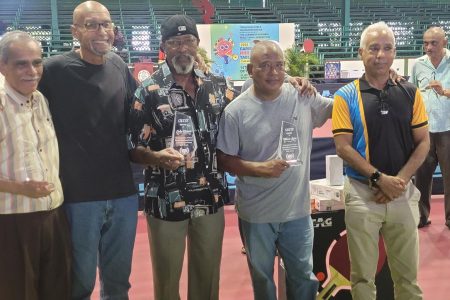 LEGENDS OF THE CARIBBEAN! From left, Mike Baptiste, Orville Haslam, Colin France, Trevor Lowe and Teddy Matthews at the Caribbean mini and pre-cadet championships which climaxed yesterday at the Cliff Anderson Sports Hall. (Donald Duff photo)