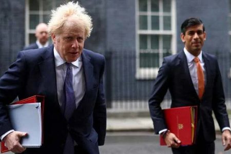 Britain's Prime Minister Boris Johnson (left) and Chancellor of the Exchequer Rishi Sunak arrive for a Cabinet meeting, in London, Britain October 13, 2020. REUTERS