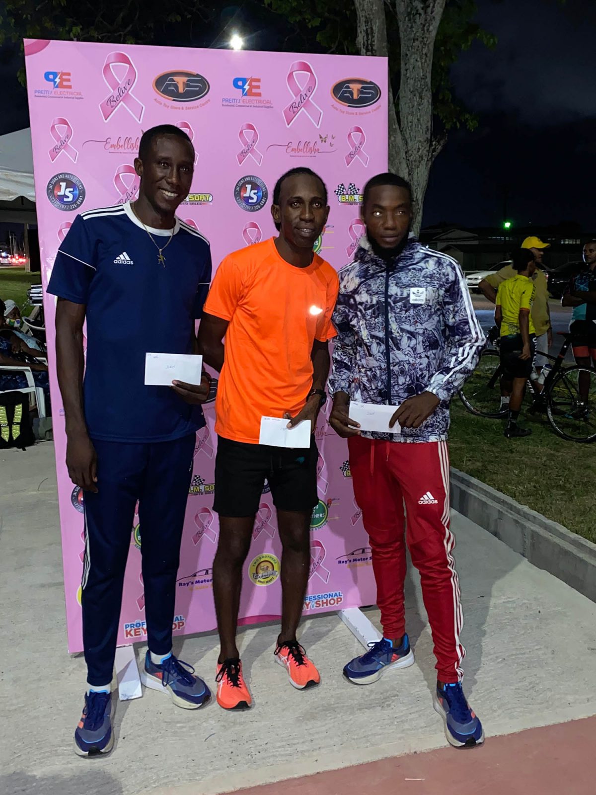 Caption Cleveland Thomas (centre), Winston Missigher (right) and Devaughn Barrington, finished 1, 2, 3 in the ‘Fireworks’ Golden Mile last evening. (Emmerson Campbell photo)