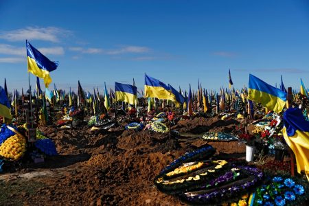 Ukrainian flags are placed at a cemetery of the Ukrainian army, in Kharkiv, Ukraine, 12 October 2022. According to the Office of the UN High Commissioner for Human Rights (OHCHR), more than 6,200 civilians have died since Russian forces in February 2022 invaded Ukrainian territory and started a conflict that has provoked destruction and a humanitarian crisis. EPA-EFE/ATEF SAFADI
