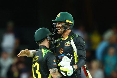 Australia’s Mitchell Starc and Matthew Wade celebrate their
team’s three wicket triumph yesterday. (Photo courtesy Twitter)