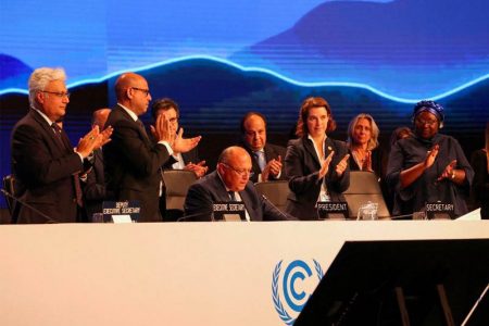 Delegates applaud as COP27 President Sameh Shoukry delivers a statement during the closing plenary at the COP27 climate summit in Red Sea resort of Sharm el-Sheikh, Egypt, on Nov 20. Reuters