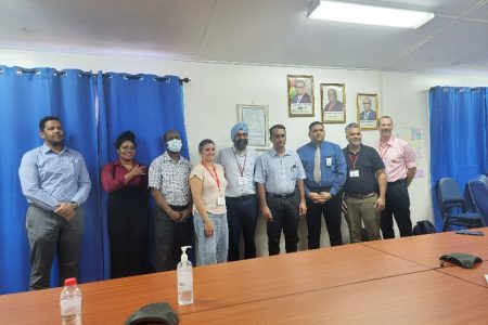 Dr Paul Khanuja (fifth from right), Dr David Samaroo (fourth from right),  CEO of the Georgetown Public Hospital Corporation Robbie Rambarran (third from right) along with doctors from Operation Walk and the GPH. 