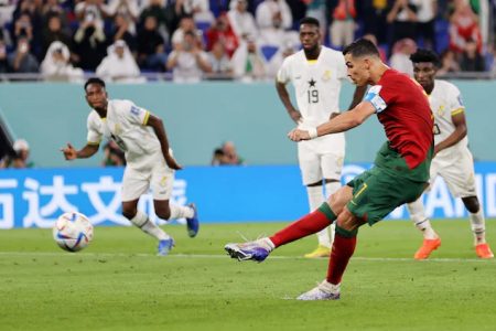 Cristiano Ronaldo scoring from the penalty spot to give Portugal the lead against Ghana and becoming the first player to score in five FIFA World Cups
