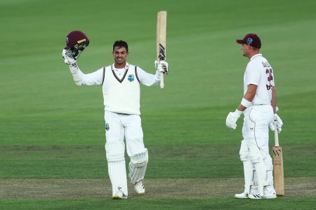Tagenarine Chanderpaul celebrating after reaching his century against the Australia PM XI
