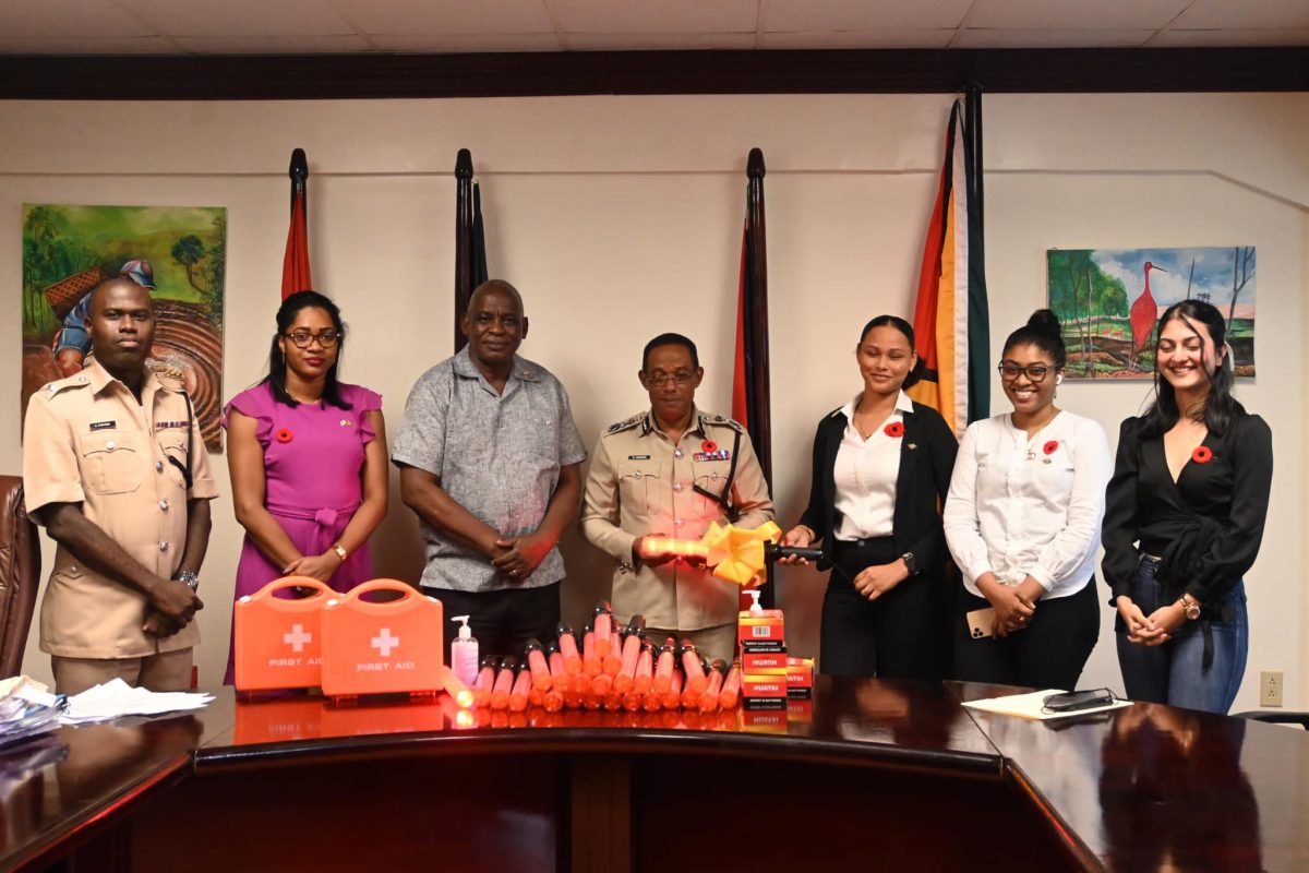 Commissioner of Police (ag), Clifton Hicken (centre) receiving the donation from representatives of Yesi Consultancy (Ministry of Home Affairs photo)