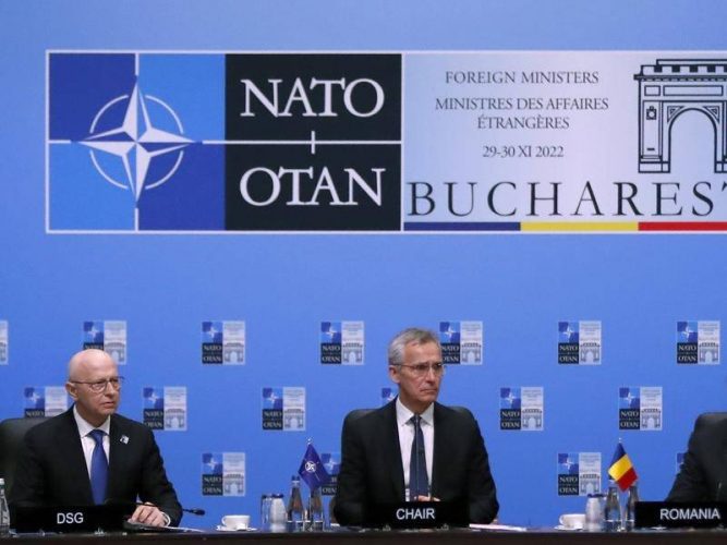 NATO head Jens Stoltenberg  (centre) says Ukraine will become a member at some point. (EPA PHOTO)