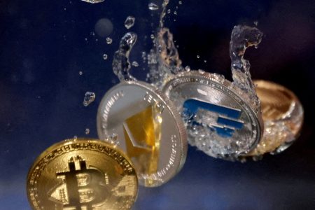 FILE PHOTO: Representations of cryptocurrencies plunge into water in this illustration taken, May 23, 2022. REUTERS/Dado Ruvic/Illustration/File Photo