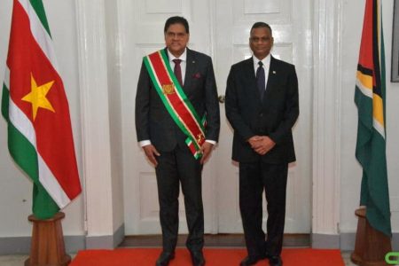Surinamese President  Chandrikapersad Santokhi  (left) with Virjanand Depoo  after the accreditation ceremony. (Ministry of Foreign Affairs photo)