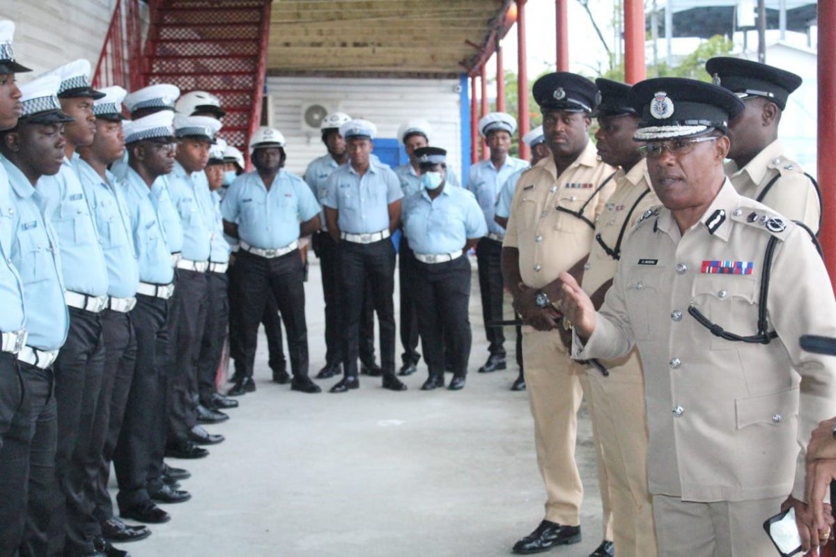 Commissioner of Police (ag) Clifton Hicken (right) addressing members of the police force yesterday. (GPF photo)