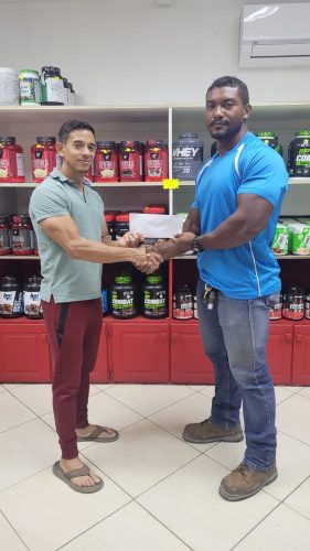 CEO of Guyana’s leading fitness supplement and gym equipment supplier, Jamie McDonald presented the Carlos Petterson-Grifith with a sponsorship pact to aid in his next international outing in New Zealand.