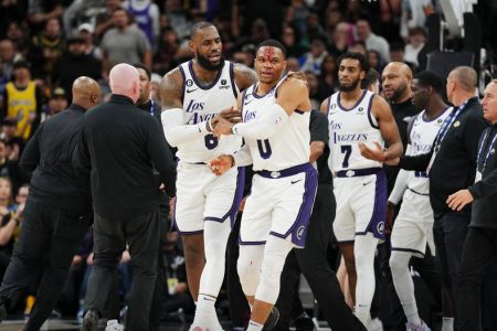 Los Angeles Lakers forward LeBron James helps Russell Westbrook after Westbrook was fouled by San Antonio Spurs forward Zach Collins. Mandatory credit Daniel Dunn –USA Today Sports.
