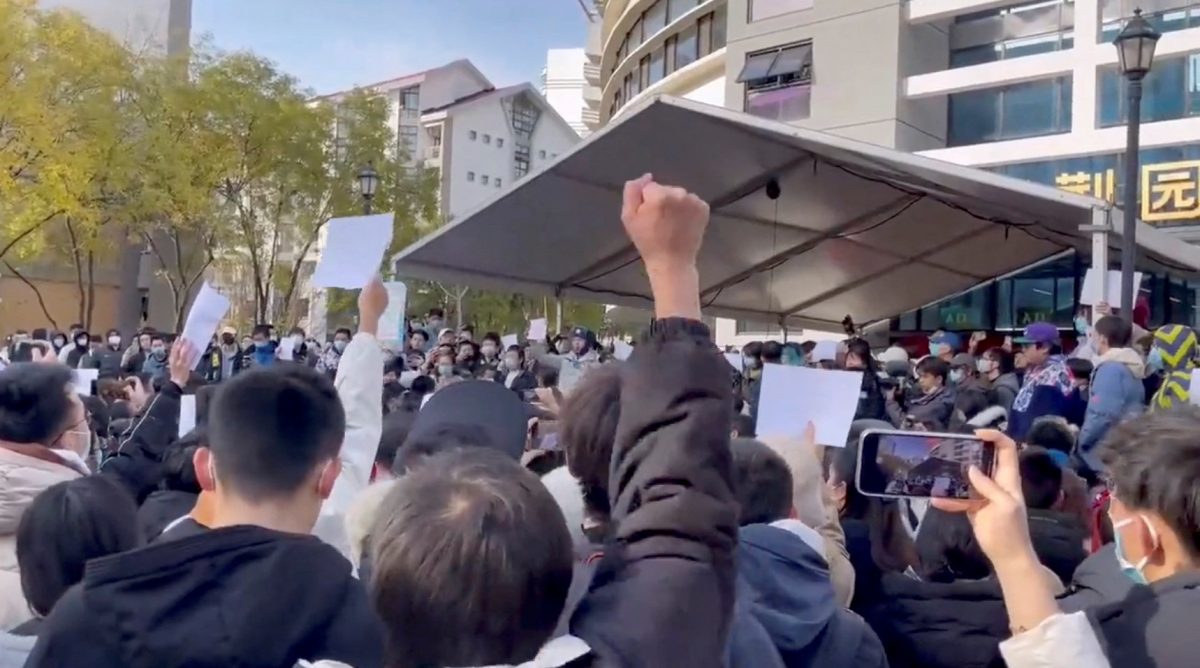 Students take part in a protest against COVID-19 curbs at Tsinghua University in Beijing, China seen in this still image taken from a video released November 27, 2022 and obtained by REUTERS.