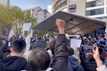 Students take part in a protest against COVID-19 curbs at Tsinghua University in Beijing, China seen in this still image taken from a video released November 27, 2022 and obtained by REUTERS.