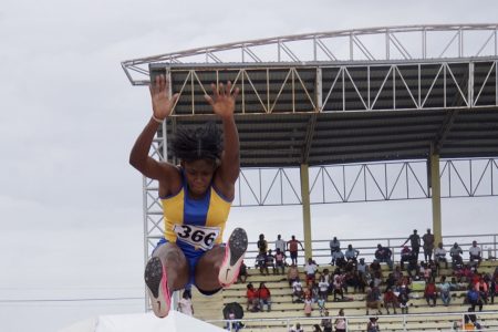 Keliza Smith’s gold medal jump Tuesday at the National Track and Field Centre. (Emmerson Campbell photo)