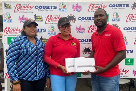 Sterling Products Marketing Manager Marlon Lynch presenting the two Samsung tablets to Petra Organization representatives were Kelly Semple and Nareeza Latif.
