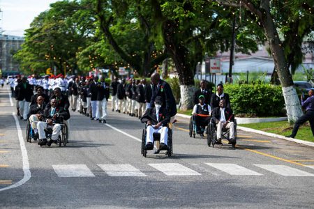 War veterans being escorted along Main Street for yesterday’s annual Remembrance Day observances commemorating those who fell in the two world wars. (Office of the President photo)