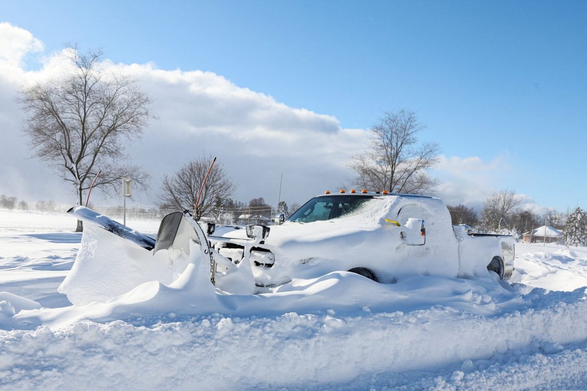 A snow plow is left stranded on the road following a winter storm that hit the Buffalo region on Main St. in Amherst, New York, U.S., December 25, 2022. REUTERS/Brendan McDermid