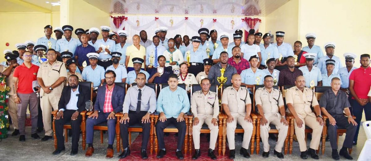 Commissioner of Police (ag), Clifton Hicken (seated centre of the front row) and senior members of the Guyana Police Force including Police Com-mander of Region Three, Mahendra Siwnarine (seated third from right in the front row) posed with awardees at the Regional Police Division Three annual Christmas Luncheon and awards ceremony. (Police photo)