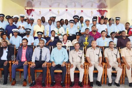 Commissioner of Police (ag), Clifton Hicken (seated centre of the front row) and senior members of the Guyana Police Force including Police Com-mander of Region Three, Mahendra Siwnarine (seated third from right in the front row) posed with awardees at the Regional Police Division Three annual Christmas Luncheon and awards ceremony. (Police photo)