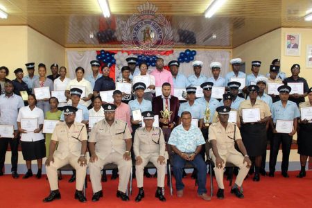 Acting Commissioner of Police, Clifton Hicken (seated centre) and Police Commander of Region Five, Kurleigh Simon (seated second from left) along with other senior ranks of the force posed with the awardees. (Police photo)
