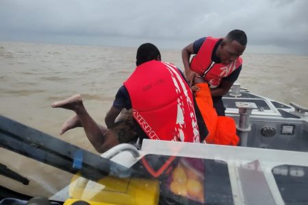 The coastguard rescuing one of the men (GDF photo) 