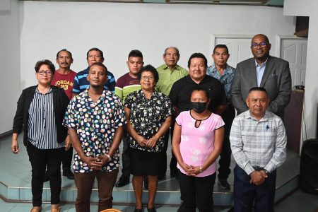 Chairman of Upper Mazaruni District Council (UMDC), Mario Hastings (second from right in centre row), Attorney Nigel Hughes (first from right in center row) and Executive Director of the Amerindian Peoples Association (APA) Jean La Rose (at left in centre row) following yesterday’s press conference. They were accompanied by leaders from villages in the Upper Mazaruni district. (APA photo)
