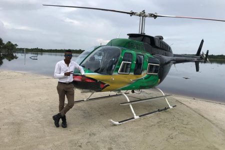 Captain Akeem Stoll with the Air Services Limited  Bell 206 helicopter 8R-GTR
