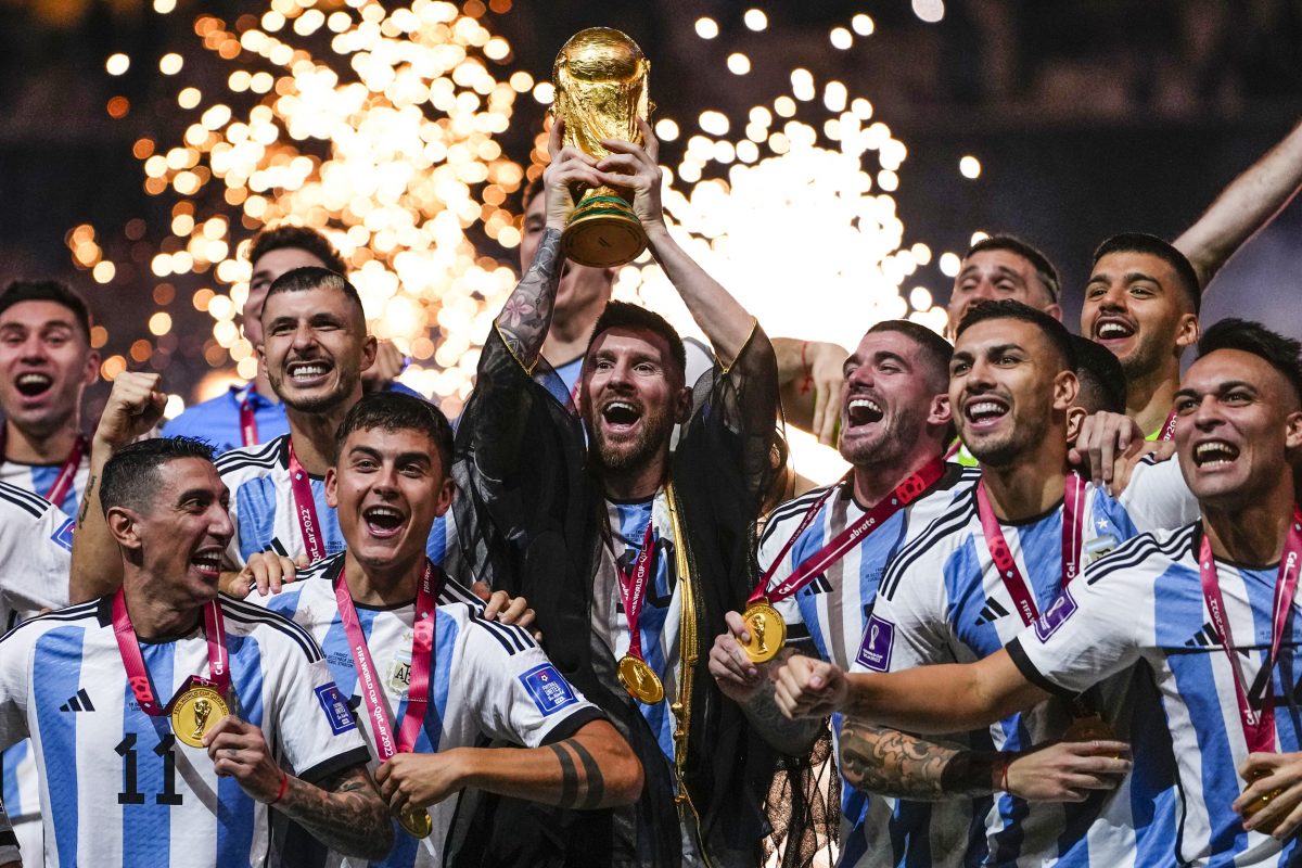Pure Ecstasy! Argentina talisman Lionel Messi lifting the 2022 FIFA World Cup in the presence of wild celebrations from teammates after defeating France 4-2 in a penalty shootout, 36 years after their previous triumph