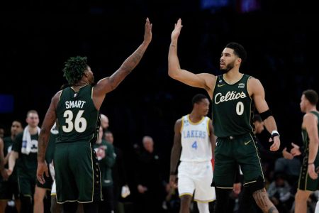 Boston Celtics Jason Tatum (right) and teammate Marcus Smart celebrating after defeating the Lakers in overtime
