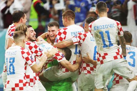 Croatia celebrates after defeating Japan in a penalty shootout to seal their place in the quarterfinal section of the 2022 FIFA World Cup