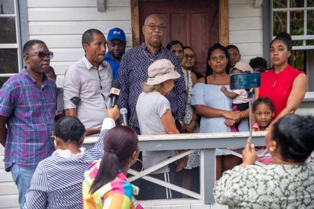 Single mother of five, Natoya Hutson of Blueberry Hill, Linden, receiving the keys to her new home (DPI photo)